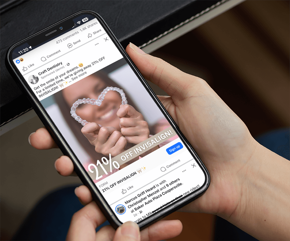 mockup-of-a-woman-holding-an-iphone-13-featuring-a-laptop-keyboard-in-the-background-m22010-r-el2